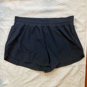 Lululemon women’s Track That Mid-Rise Lined Short 5" in navy size 18